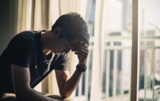 man suffering from depression and addiction