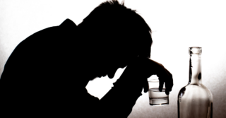 silhouette of man drinking alcohol