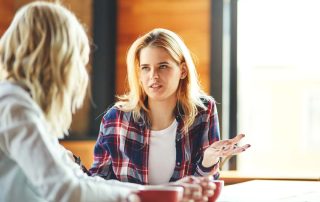 two women talking about finding addiction treatment