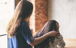 a woman helps a friend with stress awareness