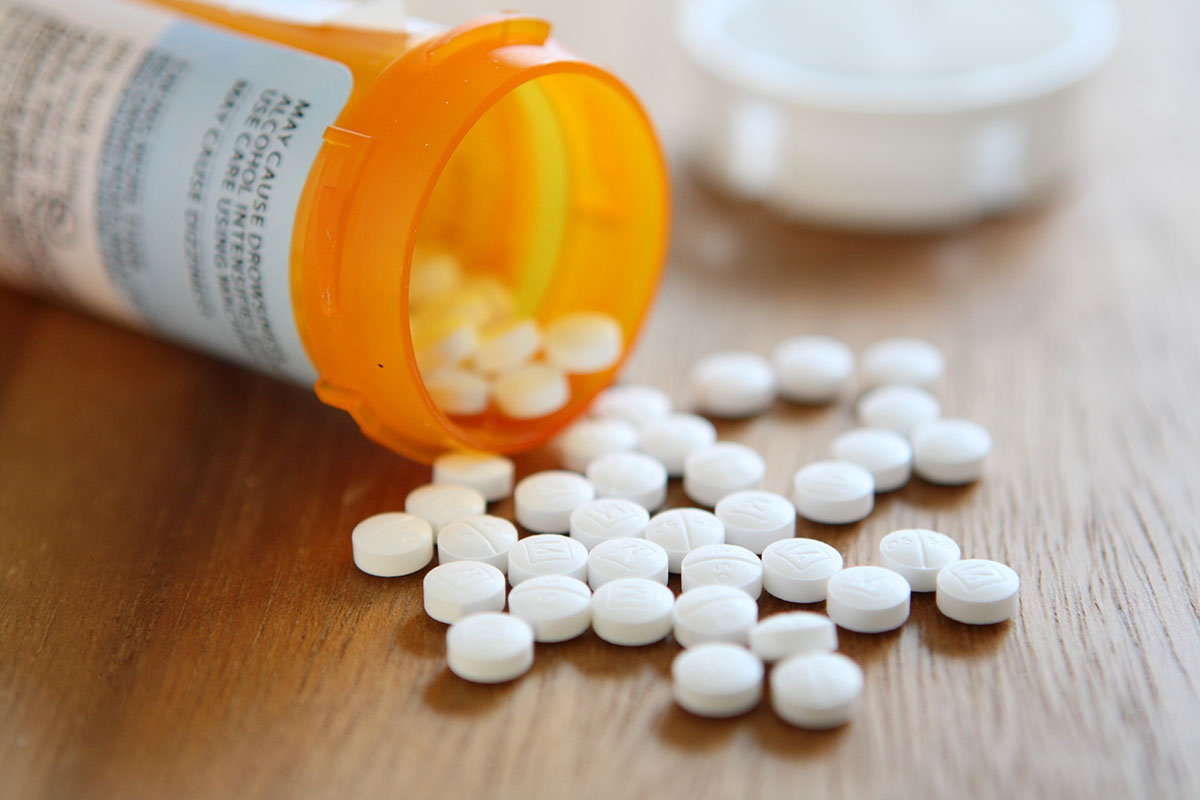 a bottle of pills represents prescription drug addiction