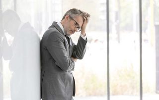 a man experiences the side effects of alcohol detox in need of alcohol addiction treatment