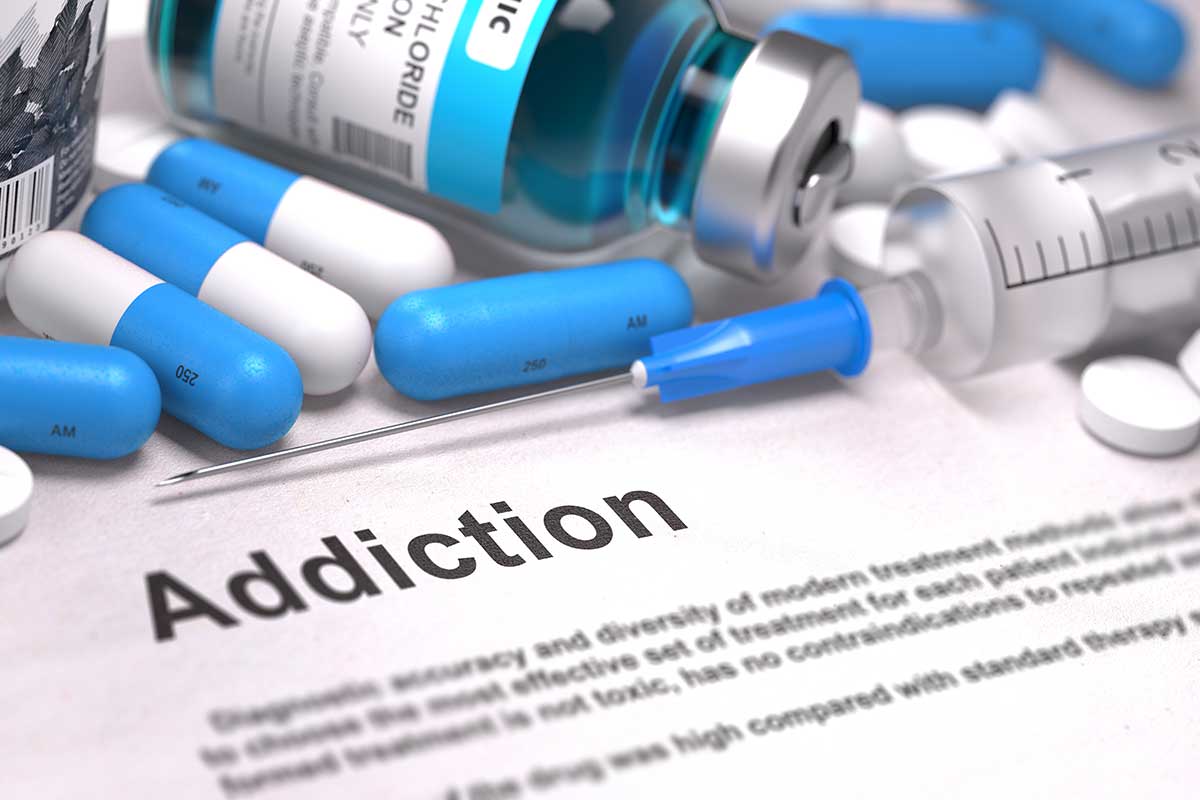 a bottle of pills and medication represents a need for an opiate addiction treatment center