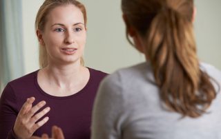woman discusses a cocaine detox program with therapist