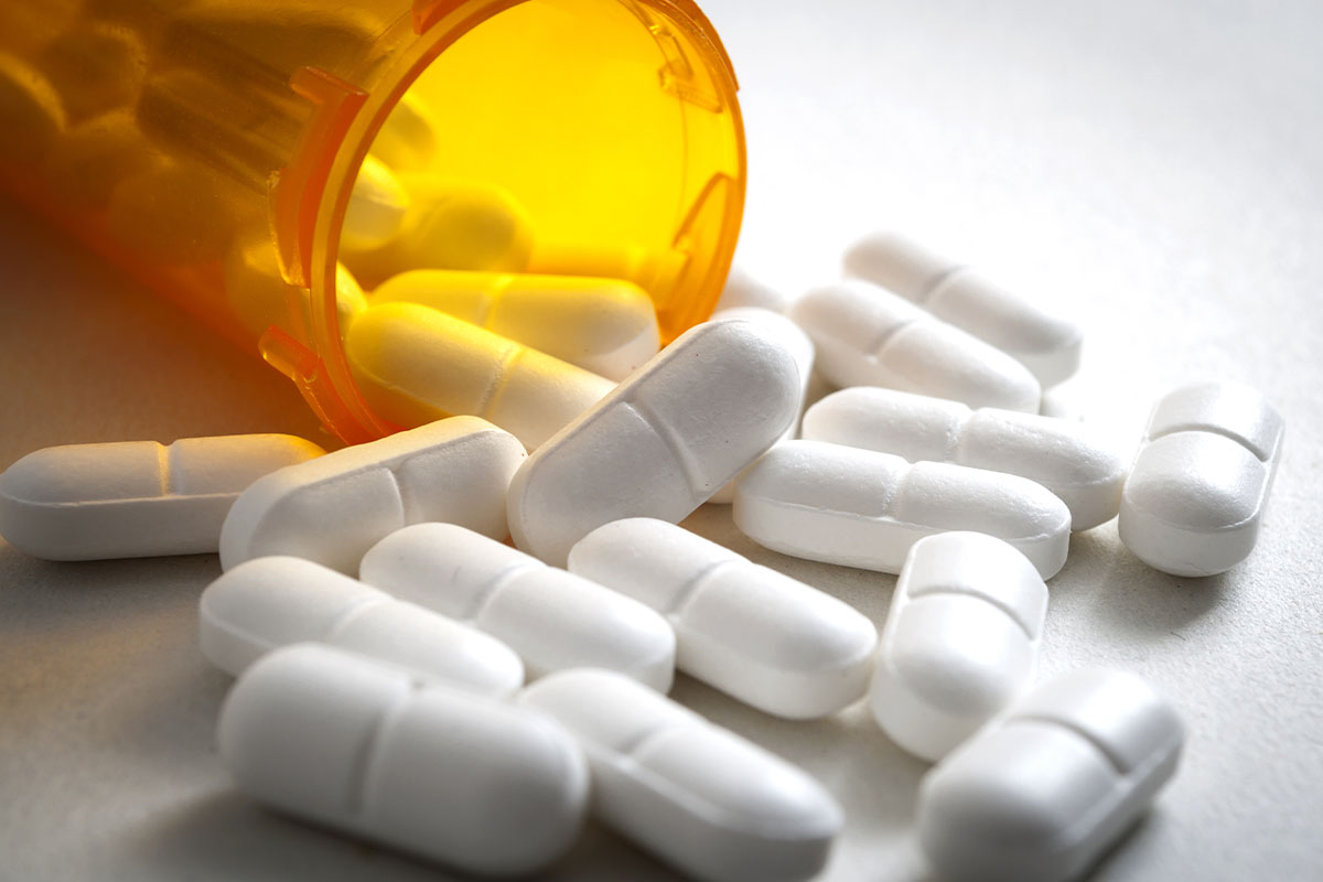 spilled pill bottle showing the risks of prescription painkillers