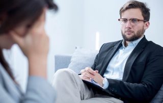 therapist listening to woman in individual therapy
