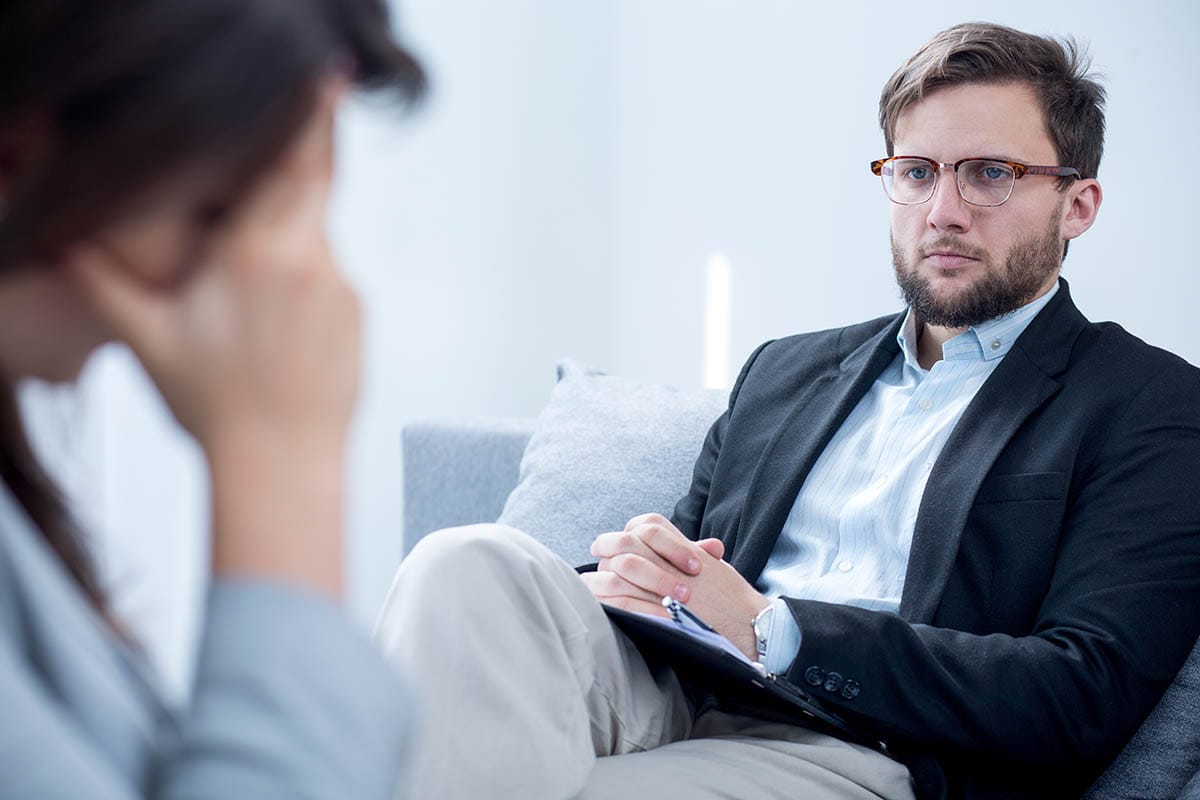 therapist listening to woman in individual therapy