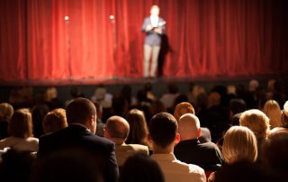 Comedian on stage telling jokes to audience - John Mulaney Netflix special concept image
