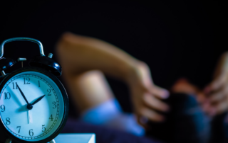 Someone can't sleep while a clock says it's late