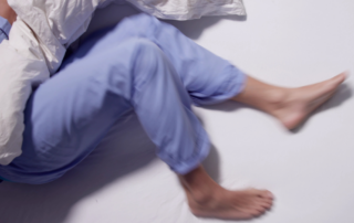 restless legs on a bed