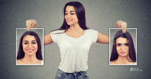Young woman holding contrasting photos of herself—one smiling, one upset—illustrating the emotional highs and lows linked to alcohol use.