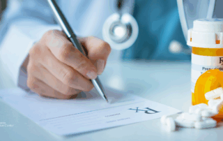 Close-up of a healthcare provider writing a prescription next to spilled medication bottles, symbolizing controlled use and monitoring of Ativan in the body.